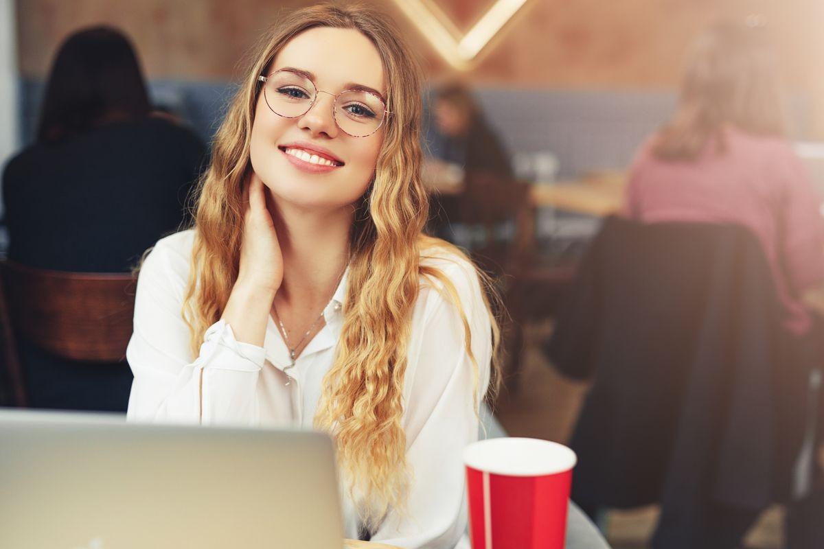 Woman Wear Glasses, Drink Her Hot Coffee While Work In Cafe On Her Laptop. Portrait Of Stylish Smiling Woman In Winter Clothes Drinking Hot Coffee And Work At Laptop. Female Winter Style. - Image Woman Wear Glasses, Drink Her Hot Coffee While Work In Cafe On Her Laptop. Portrait Of Stylish Smiling Woman In Winter Clothes Drinking Hot Coffee And Work At Laptop. Female Winter Style. - Image